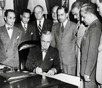 President Truman signs the Luce-Celler Act